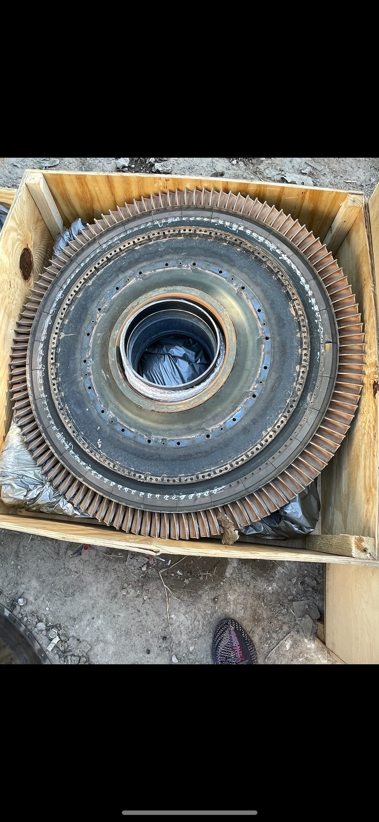 Large aircraft-engine rotor assembly packed in a wooden crate